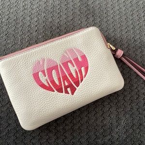Small white Coach Wristlet